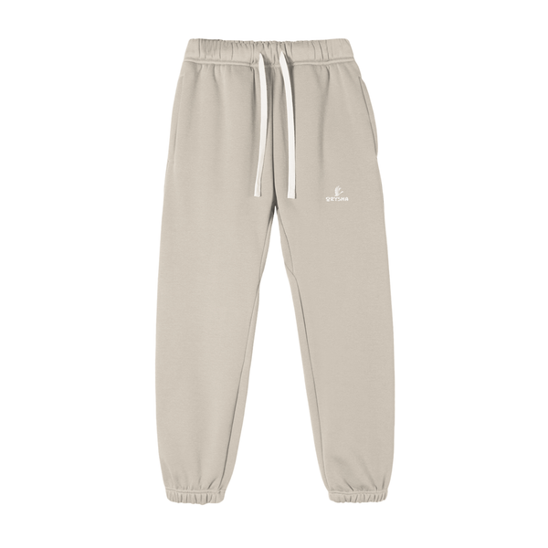 Beige sweatpants with a brand logo on a white background