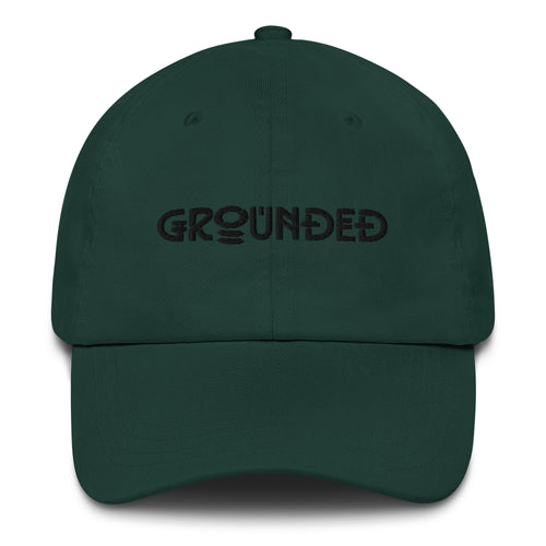 Orysha Grounded embroidered dad hat featuring minimalist embroidered lettering, curved visor, and adjustable low-profile fit.