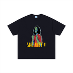 Black t-shirt with a colorful graphic and text on a white background