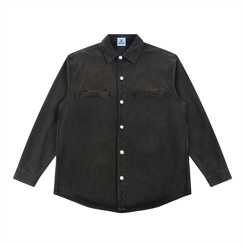 Black denim shirt with white buttons on a white background