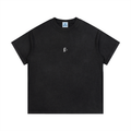 Black t-shirt with a small logo on a white background
