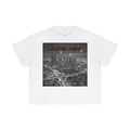 White t-shirt with a graphic of a cityscape and 'LEGEND MADE' text on a white background