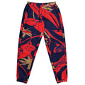 Tropic Noir track pants with bold red and navy tropical graphic design and relaxed fit