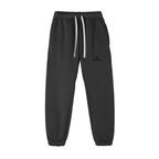 Black pants with decorative buttons on a white background