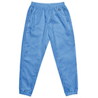 Women’s sky blue water-resistant track pants with relaxed fit and mesh lining
