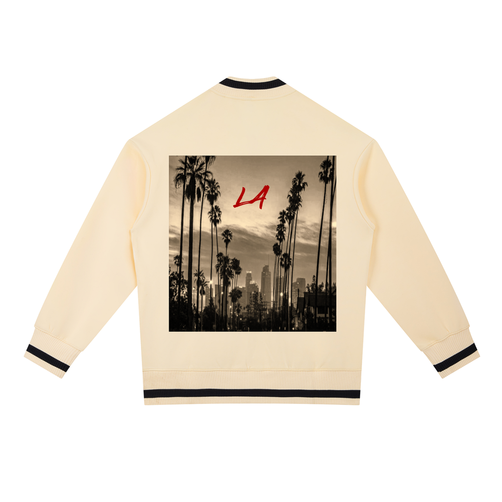 Beige bomber jacket with a black and white graphic of palm trees and 'LA' on the back, on a white background.
